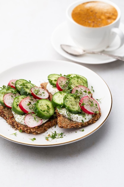 Keto Toasts with cucumber egg mozzarella and microgreens