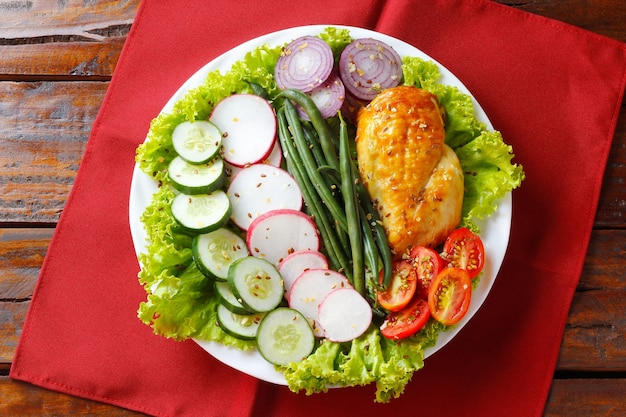 Ketogenic or paleo diet plate grilled chicken breast and vegetables on rustic wooden table Low carb food healthy eating top view