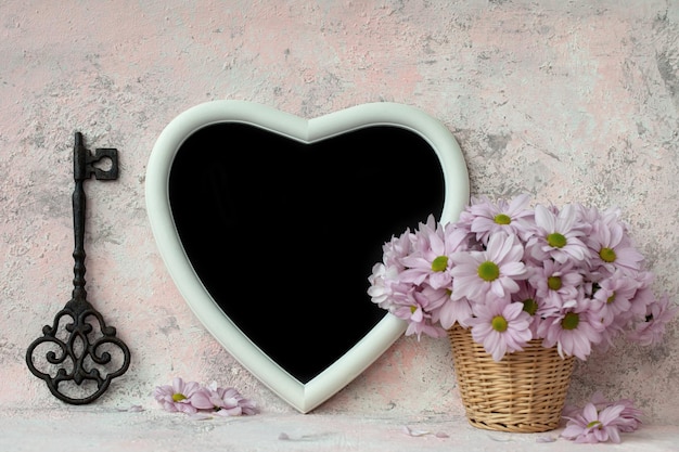 Key heart board and bouquet of chrysanthemums