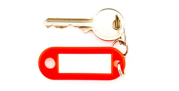 Key with a blank tag, isolate on white background. Add your text on the tag.