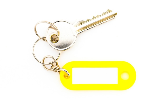 Key with a blank tag, isolate on white background. Add your text on the tag.