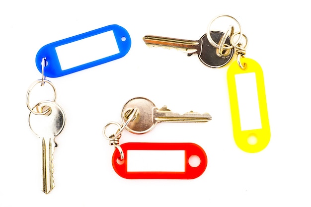 Key with a blank tag, isolate on white background. Add your text on the tag.