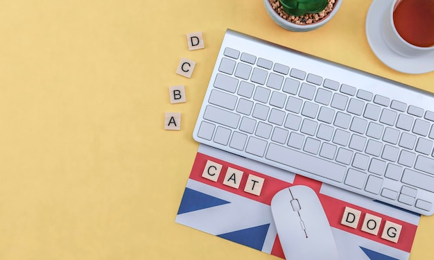 Keyboard and coffee on a yellow background