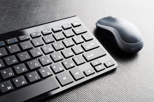 Keyboard and mouse on the table .