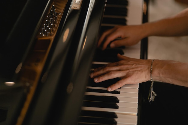 The keyboard of a very old abandoned piano is covered with dust some keys have dropped some are absent