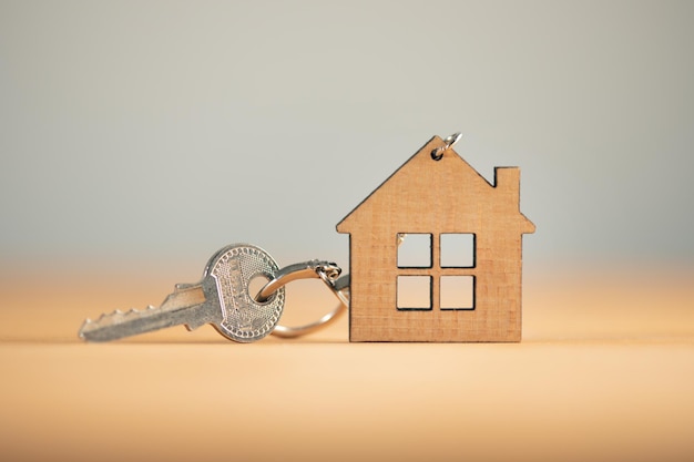 Keys from house on the wooden table background