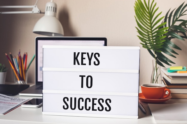 Keys to success concepts with text on light box