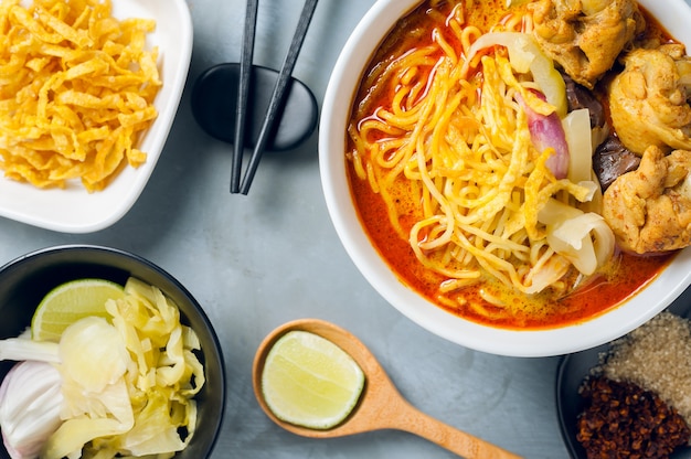 Khao Soi Kai, Northern Style Egg Noodle in Chicken Curry With Ingredients. Thai Food 