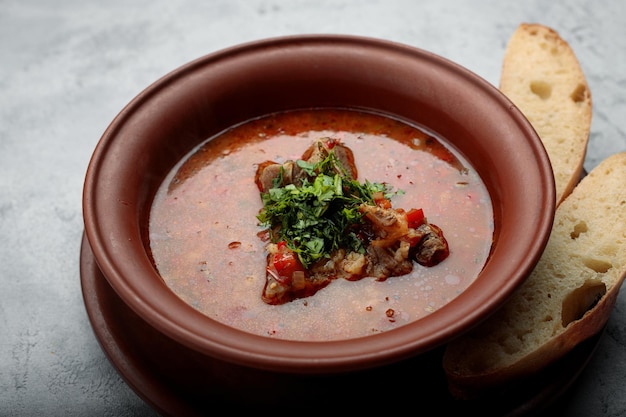 Kharcho soup with meat bread and herbs