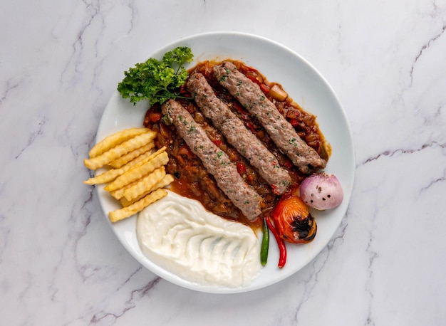 khashkhash kebab with fries and sauce