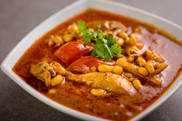 Khoresh chicken served in dish isolated on grey background top view of arabic food