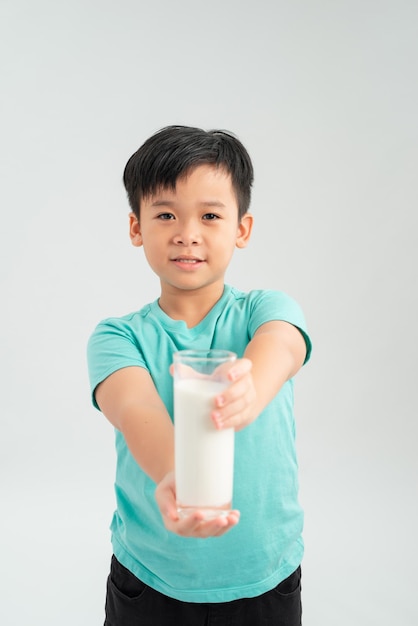 Kid drinking milk on white background