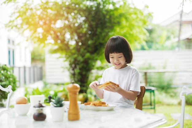 Kid eating food happy time breakfastxA