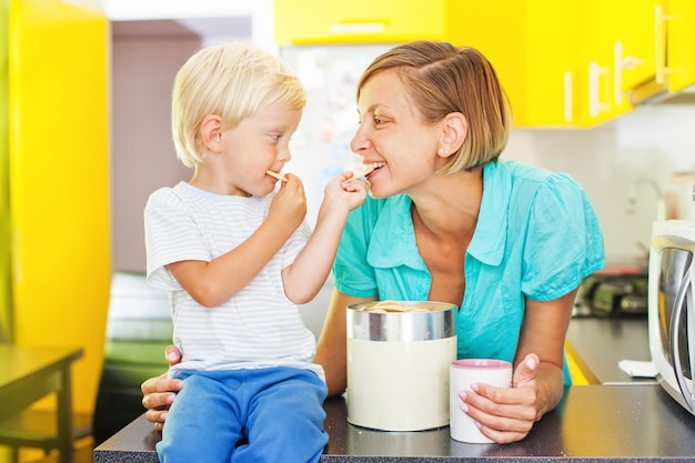 Kid feeding his mom biscuits