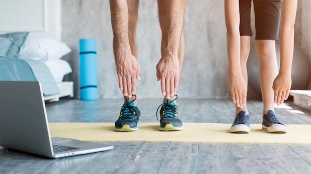 Kid and his father doing sport at home