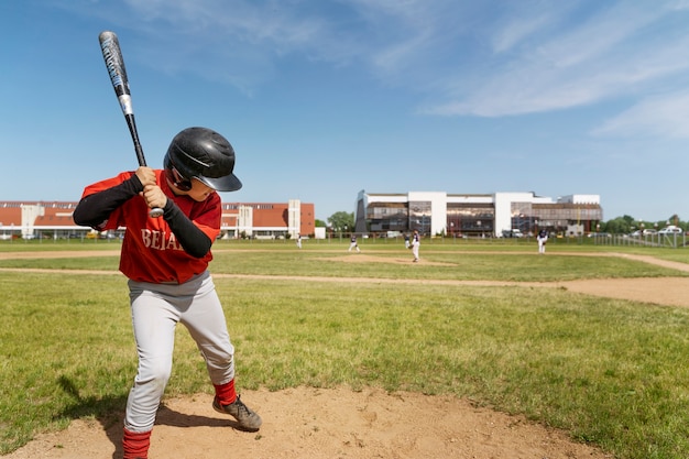 Kid holding baseball bat full shot