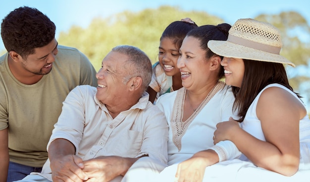 Kid parents and grandparents picnic in park happy family have fun and spending time together in New Zealand Nature love and family men and women with girl child generations on summer weekend