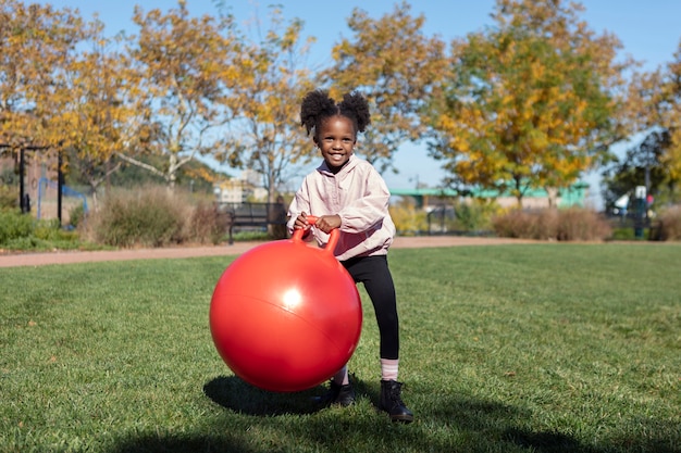 Kid playing outdoorns in the park