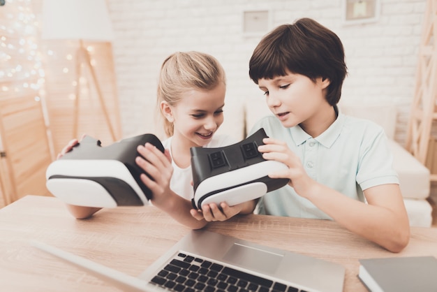 kid playing with vr glasses