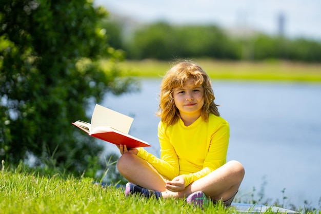 Kid read a book early education for kids summer vacation with reading book outdoor homework summer