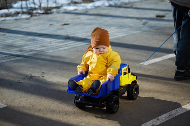 Kid rides a big toy truck