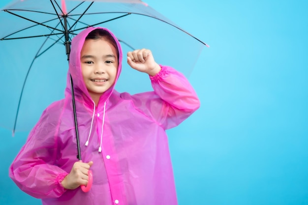 Kid smart and curious, children close up photo of cute and cheerful people, holding umbrella