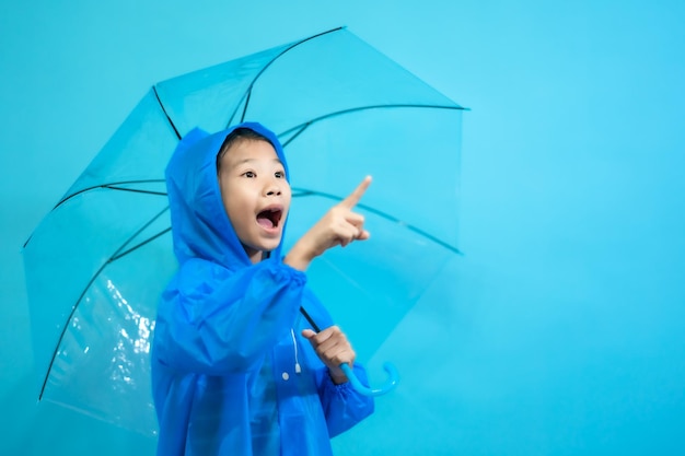 Kid smart and curious, children close up photo of cute and cheerful people, holding umbrella