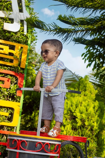 Kid standing in the Park, Baby boy smiling standing in the park