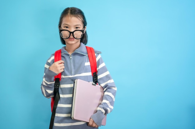 Kid student, Asian children close up of cute and cheerful people, wearing glasses and holding laptop