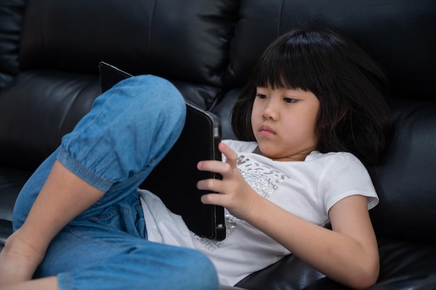 Kid watching tablet child addicted cartoon