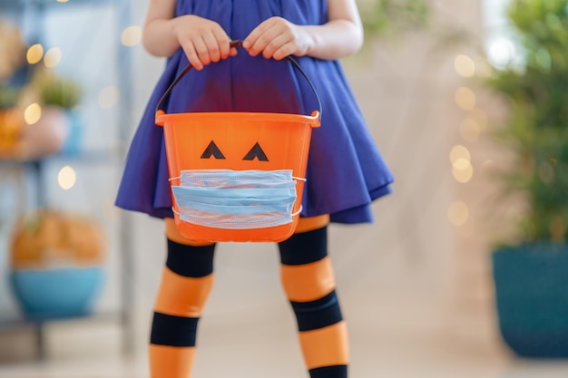 Kid with a basket for sweets