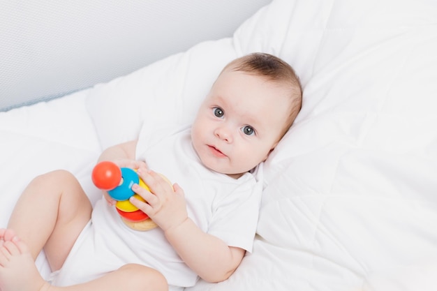 A kid with a wooden pyramid Happy baby Children's toys