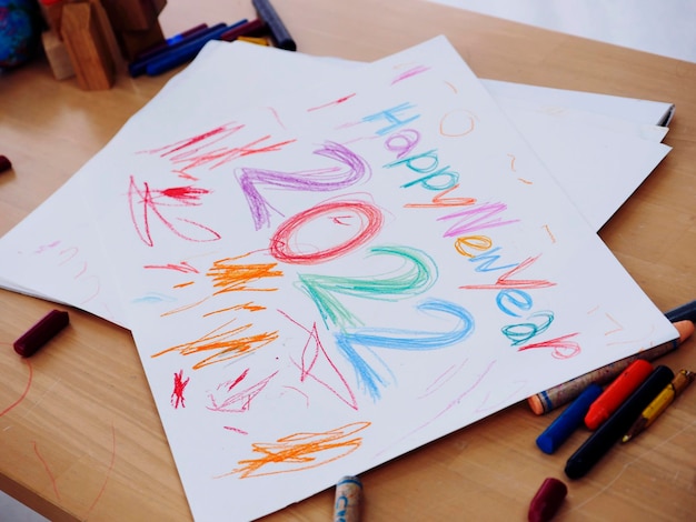 KidÃÂÃÂ¢ÃÂÃÂÃÂÃÂs drawing new year 2022 with painting crayon on paper