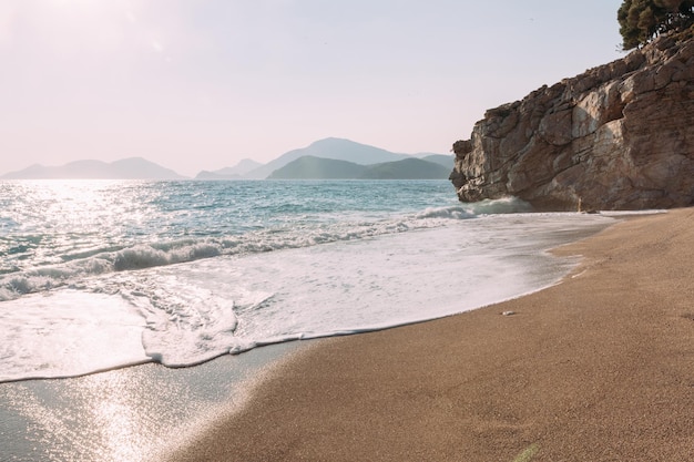 Kidrak beach at sunset Coast in Oludeniz Mugla region in Turkey on summer day Travel destination