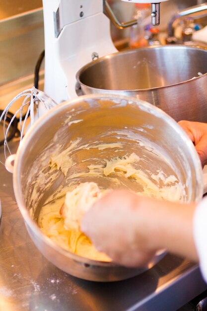 Kids in cooking class learning how to cook and bake.