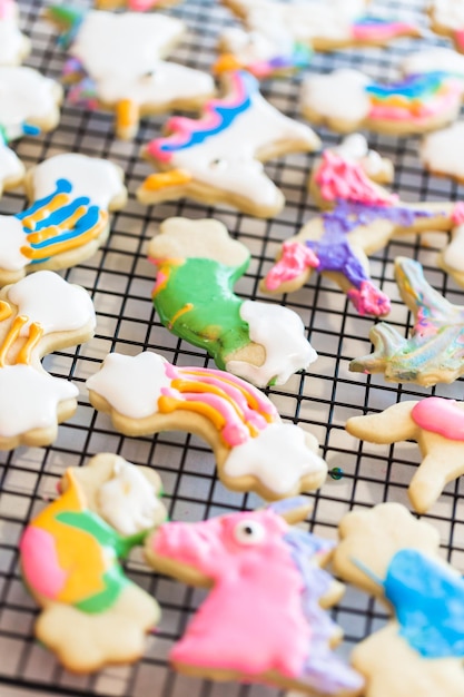 Kids craft. Decorated with royal icing unicorn cookies on drying rack.