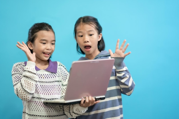 Kids happy, Asian children close up cute and cheerful people, holding labtop looking and smile