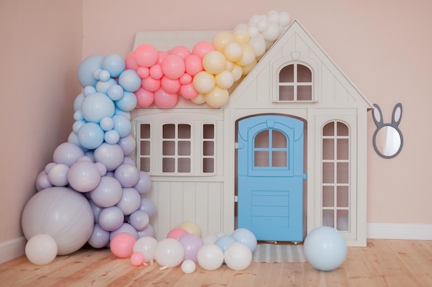 Kids playhouse with air balloon decorations. Rainbow balloons