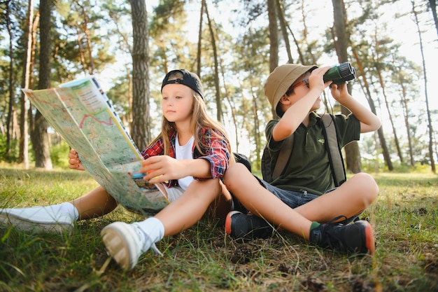 Photo kids scouts in the forest