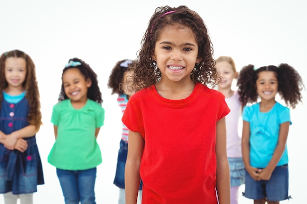 Kids standing together with girl in front