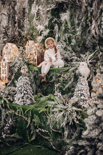 Kids standing on the upper level of Christmas decoration