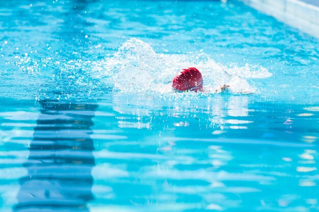 Kids swim meet in outdoor pool during the summer.