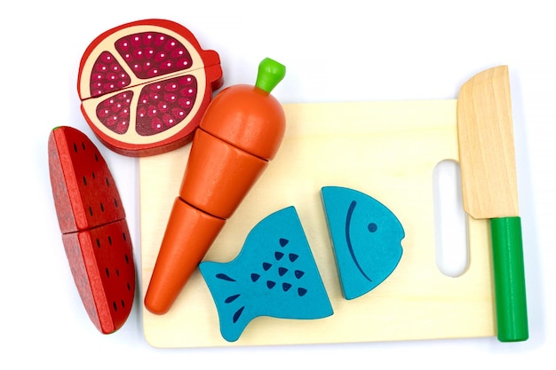 Kids toy wooden vegetables in background close up children's developing wooden game a set of wooden vegetables