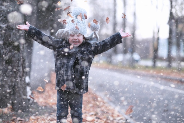 Kids walk in the park first snow