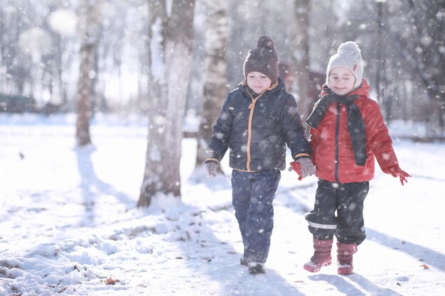 Kids walk in the park with first snow