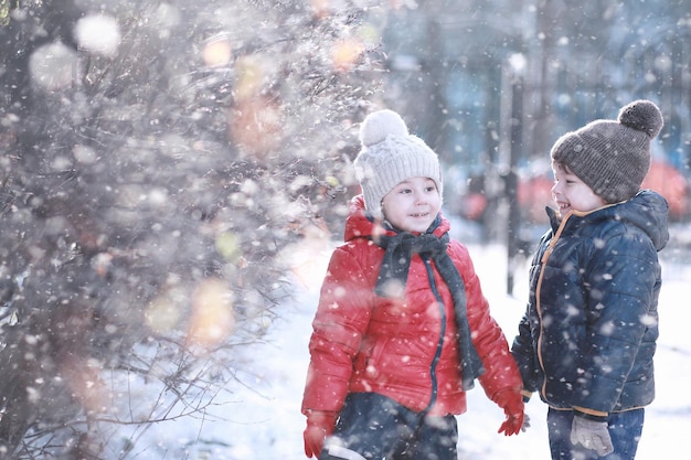 Kids walk in the park with first snow