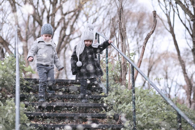 Kids walk in the park with first snow