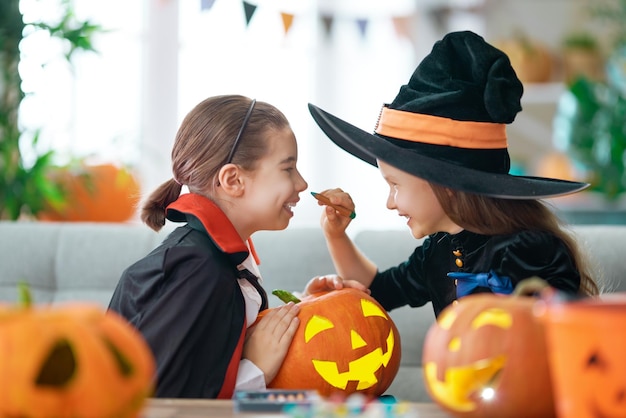 Kids with carving pumpkin