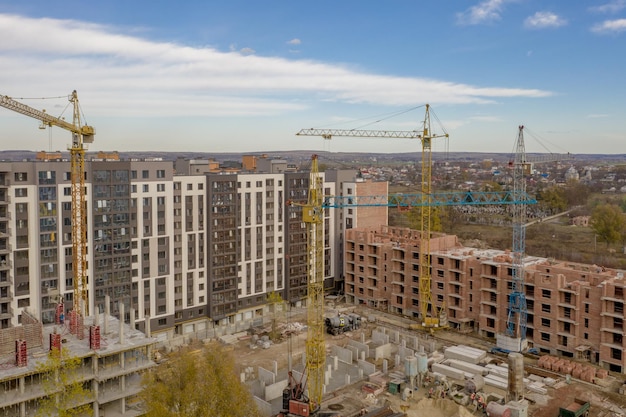 Kiev Ukraine June 10 2019 Sonstruction of a new multistory residential complex Cranes and building construction site Modern apartment buildings is being building