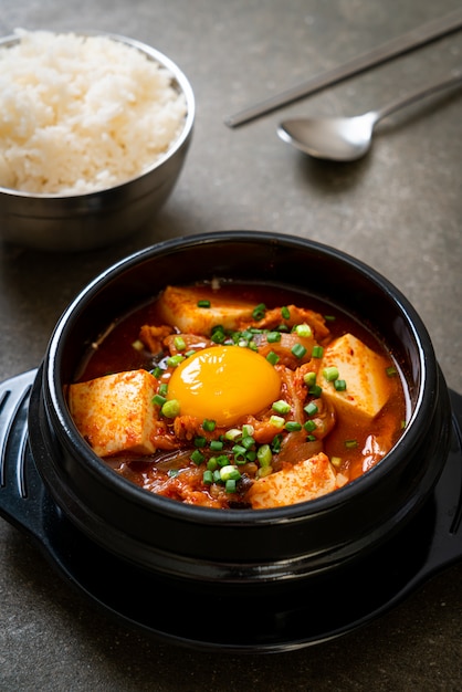 ‘Kimchi Jjigae’ or Kimchi Soup with Tofu and Egg or Korean Kimchi Stew